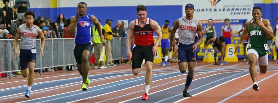Male sprinters race down the straightaway during the 2019 Class 3A State Indoor Meet.